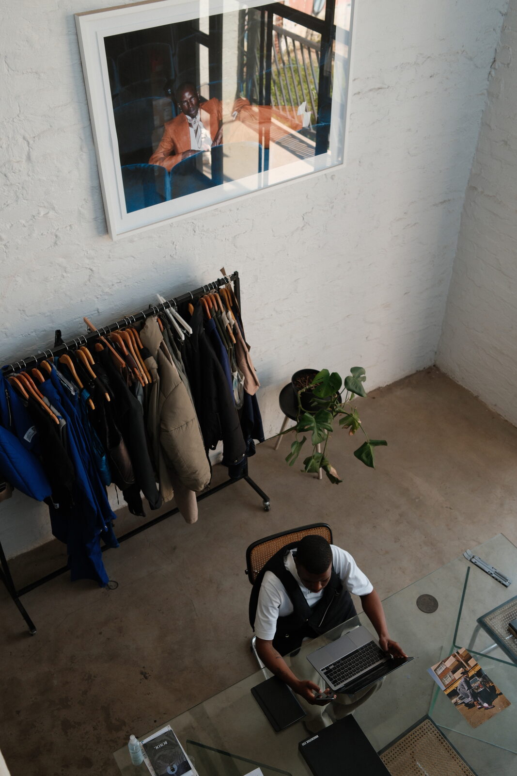 Dineo at the sewing machine, hands guiding fabric
