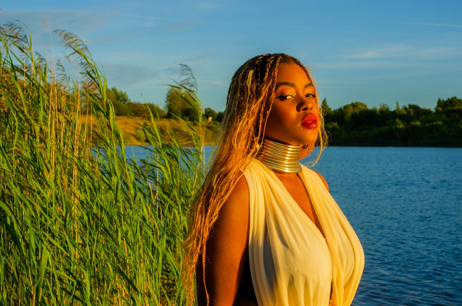 Glacia photographed beside a lake at golden hour