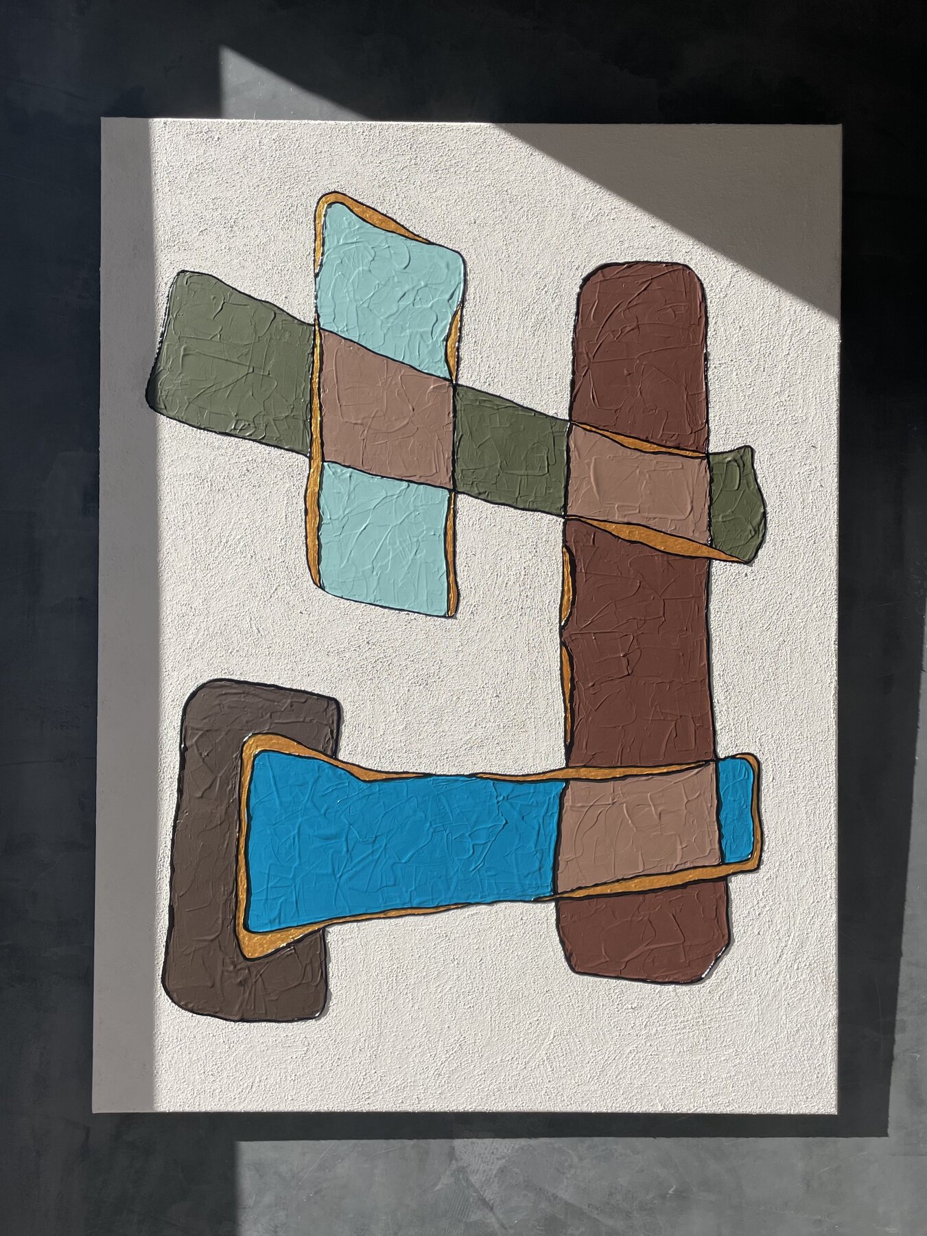 Painting by Keziah Jade Swinford — interlocking forms in green, blue, brown, and rust outlined in ochre
