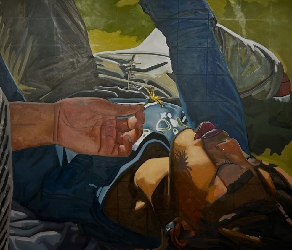 Oil painting by Oni Speelman — a figure lying on grass, painted from above, with a flower held by another hand