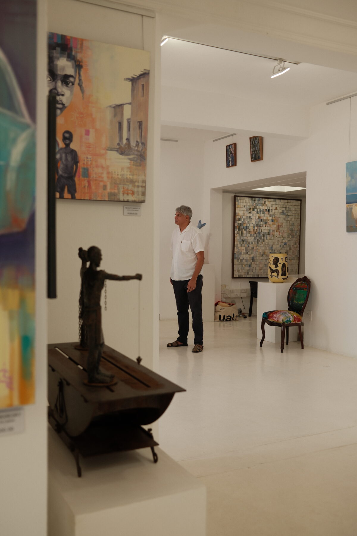 Wide view of the gallery showing Shaunez Benting's works alongside sculpture and mixed media pieces